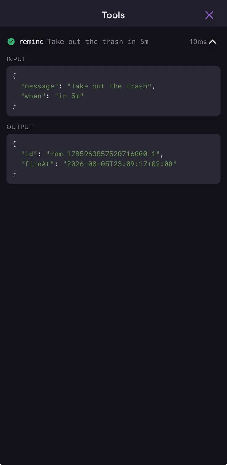 The tools window for that turn: remind succeeded in 10 ms, with the input arguments and the returned reminder id and fire time.